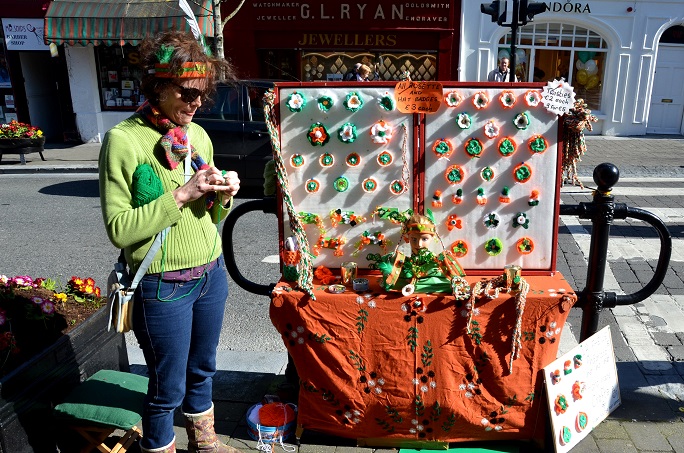 Vendor on Kilkenny's High Street Knits Rosettes and Hat Badges for St. Patrick's Day